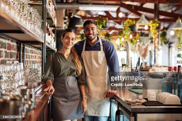small business, pub owner and portrait of couple, smile at cafe counter and hospitality startup investment. success, confidence and man with woman in service industry, management and bespoke wine bar - business smile stockfoto's en -beelden