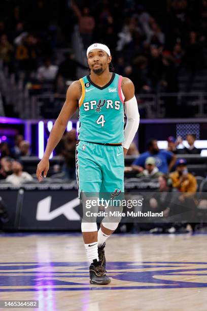 Devonte' Graham of the San Antonio Spurs walks the court during overtime of a game against the Detroit Pistons at Little Caesars Arena on February...