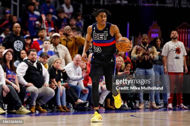 Jaden Ivey of the Detroit Pistons dribbles up the court during overtime of a game against the San Antonio Spurs at Little Caesars Arena on February...