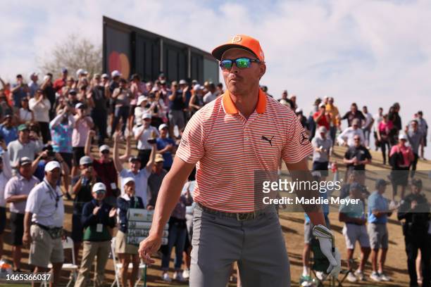 Rickie Fowler of the United States celebrates his hole-in-one on the seventh hole during the final round of the WM Phoenix Open at TPC Scottsdale on...