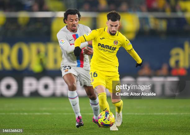 Jules Kounde of FC Barcelona battles for possession with Alex Baena of Villarreal CF during the LaLiga Santander match between Villarreal CF and FC...