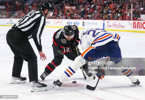 Alex DeBrincat of the Ottawa Senators takes a face-off against Leon Draisaitl of the Edmonton Oilers at Canadian Tire Centre on February 11, 2023 in...