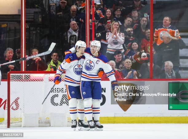 Ryan McLeod of the Edmonton Oilers celebrates his second period goal against the Ottawa Senators with Connor McDavid at Canadian Tire Centre on...
