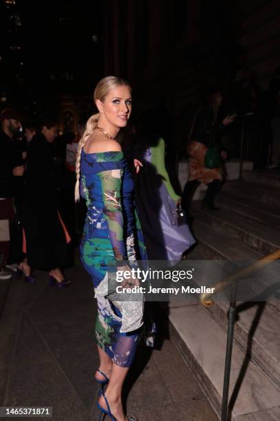 Nicky Hilton Rothschild is seen wearing a blue green and white off-shoulder dress, golden chain and a silver sparkling handbag outside the Prabal...