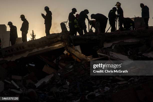 Volunteers and rescue teams search a destroyed building on February 12, 2023 in Adiyaman, Turkey. A 7.8-magnitude earthquake hit near Gaziantep,...