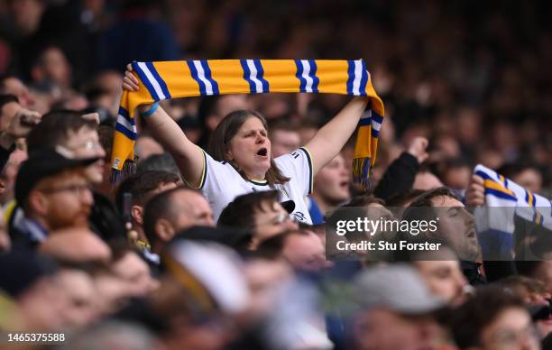 Female Leeds United fan supports her team from the Don Revie stand during the Premier League match between Leeds United and Manchester United at...