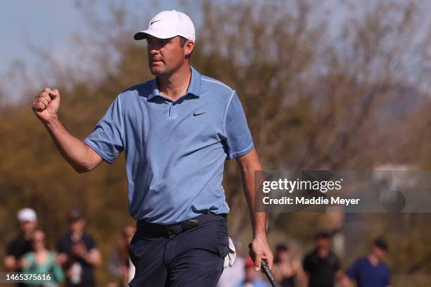 Scottie Scheffler of the United States reacts to his putt on the 13th green during the final round of the WM Phoenix Open at TPC Scottsdale on...