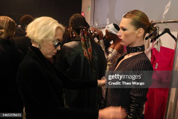 Designer Chiara Boni prepares a model at the Chiara Boni show during New York Fashion Week: The Shows at Gallery at Spring Studios on February 12,...