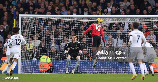 Marcus Rashford of Manchester United heads the opening goal past Leeds goalkeeper illan Meslier during the Premier League match between Leeds United...