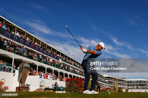 Scottie Scheffler of the United States plays his shot from the 16th tee during the final round of the WM Phoenix Open at TPC Scottsdale on February...