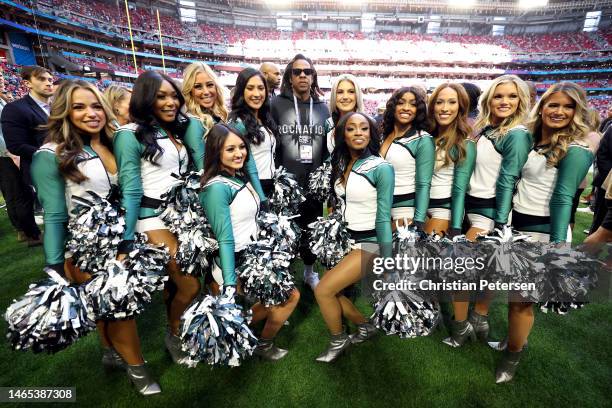 Jay-Z poses with the Philadelphia Eagles cheerleaders before Super Bowl LVII between the Kansas City Chiefs and the Philadelphia Eagles at State Farm...