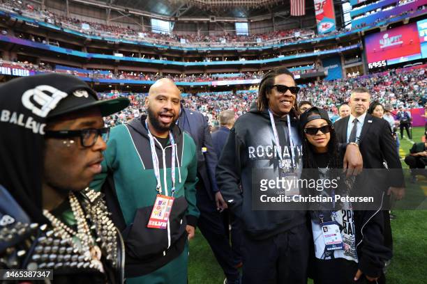 Jay-Z poses looks on with his daughter Blue Ivy Carter before Super Bowl LVII between the Kansas City Chiefs and the Philadelphia Eagles at State...