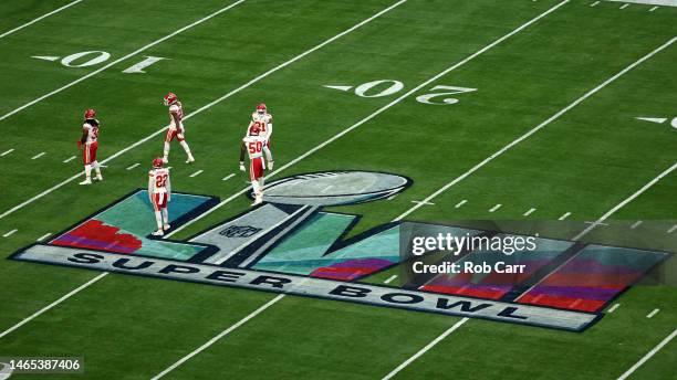 The Super LVII logo is seen on the field as the Kansas City Chiefs warm up before playing against the Philadelphia Eagles in Super Bowl LVII at State...