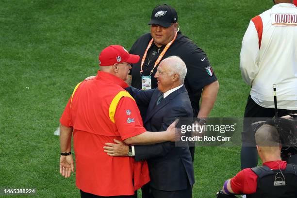 Head coach Andy Reid of the Kansas City Chiefs and Philadelphia Eagles owner Jeffrey Lurie embrace on the field prior to Super Bowl LVII at State...