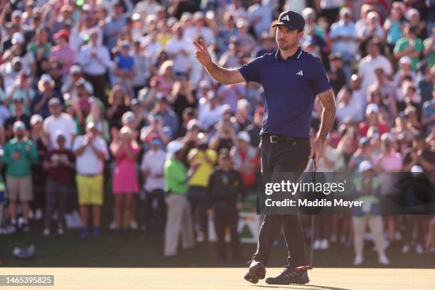 Nick Taylor of Canada waves on the 18th green during the final round of the WM Phoenix Open at TPC Scottsdale on February 12, 2023 in Scottsdale,...