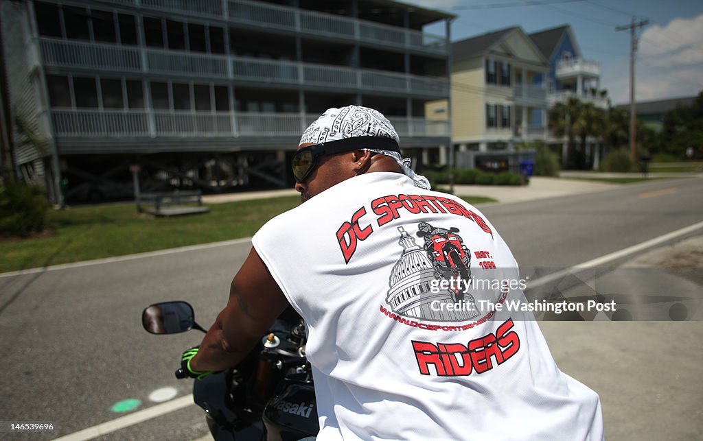 Outside their beach rental house in Surfside Beach, South Carolina, David Young of Fort Washington, Maryland leads the way before the start of a DC Sportbike Riders ride.