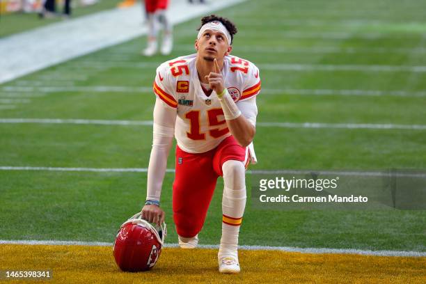 Patrick Mahomes of the Kansas City Chiefs kneels on the field before playing against the Philadelphia Eagles in Super Bowl LVII at State Farm Stadium...