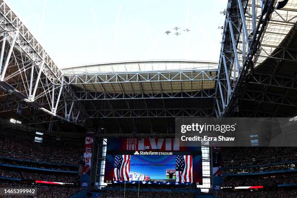 Navy pilots perform a flyover before Super Bowl LVII between the Kansas City Chiefs and the Philadelphia Eagles at State Farm Stadium on February 12,...