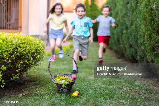 easter morning egg hunting - kid boiled egg stock pictures, royalty-free photos & images