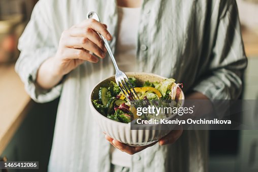 Woman holding bowl with products for heart-healthy diet, closeup Woman holding bowl with products for heart-healthy diet, closeup