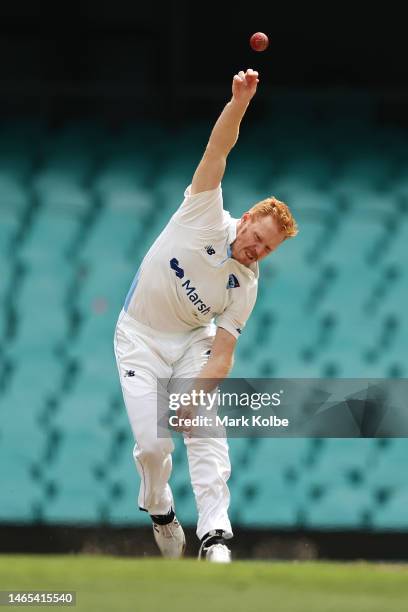 Liam Hatcher of the Blues bowls during the Sheffield Shield match between New South Wales and Tasmania at Sydney Cricket Ground, on February 13 in...