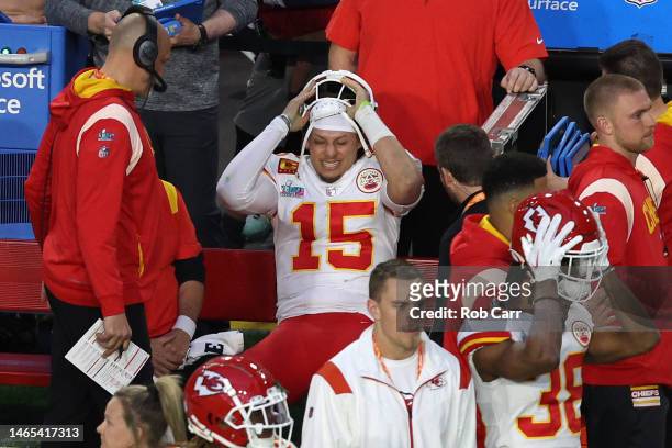 Patrick Mahomes of the Kansas City Chiefs reacts on the bench after an apparent injury during the second quarter against the Philadelphia Eagles in...