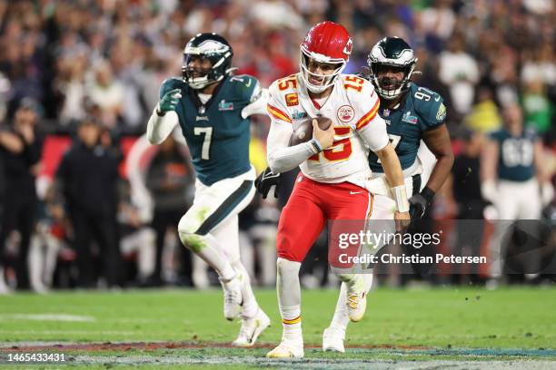 Patrick Mahomes of the Kansas City Chiefs runs the ball against Javon Hargrave of the Philadelphia Eagles during the fourth quarter in Super Bowl...