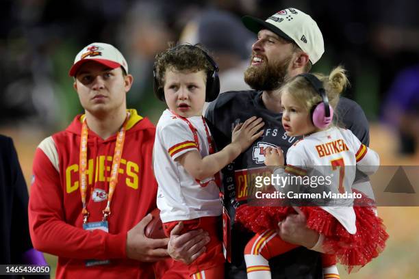 Harrison Butker of the Kansas City Chiefs celebrates with his children after kicking the go ahead field goal to beat the Philadelphia Eagles in Super...