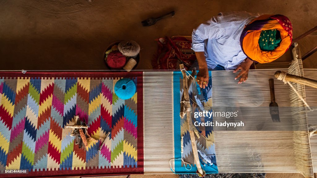 Indian man weaving textiles (durry) in Rajasthan