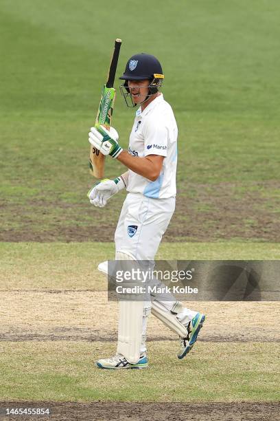 Daniel Hughes of the Blues celebrates his half century during the Sheffield Shield match between New South Wales and Tasmania at Sydney Cricket...