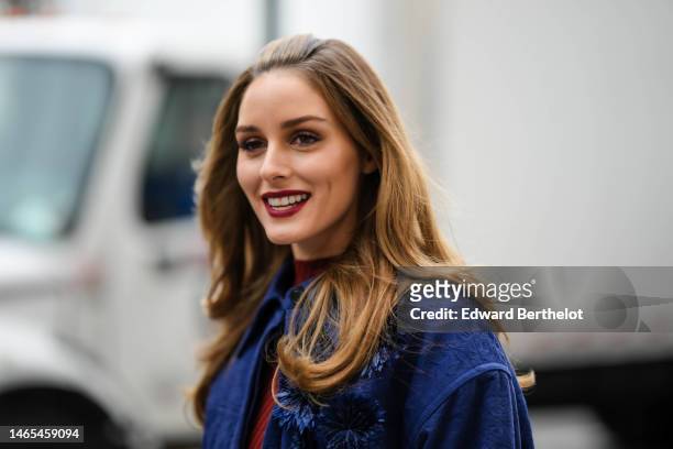 Olivia Palermo wears a red striped print pattern high neck / long sleeves t-shirt, a navy blue embossed pattern jacket, outside Jason Wu, during New...