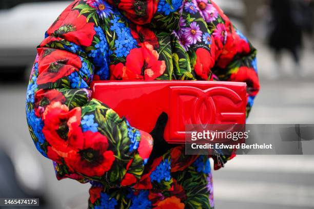 Guest wears a red / blue / green flower print pattern hoodie / oversized puffer jacket, matching red / blue / green flower print pattern tube knees...