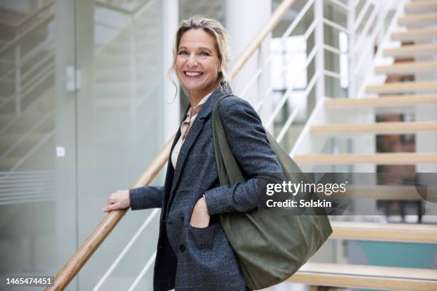 female teacher in school hallway - lecture hall bildbanksfoton och bilder