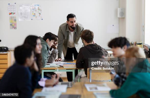 teacher working in school classroom - arab student kids stock pictures, royalty-free photos & images