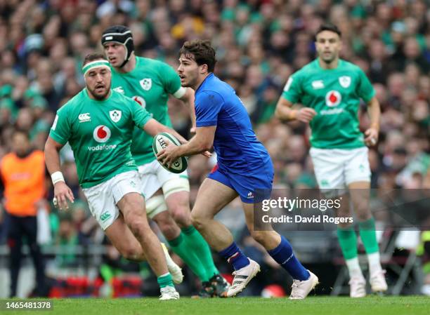 Antoine Dupont of France runs with the ball during the Six Nations Rugby match between Ireland and France at the Aviva Stadium on February 11, 2023...