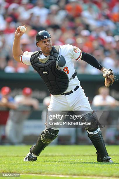 Ronny Paulino of the Baltimore Orioles fields a bunt during an interleague baseball game against the Philadelphia Phillies on June 10, 2012 at Oriole...