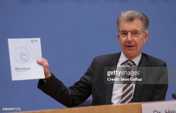 Christoph Heusgen, Chairman of the Munich Security Conference, holds up the MSC 2023 Security Report as he speaks to the media on February 13, 2023...