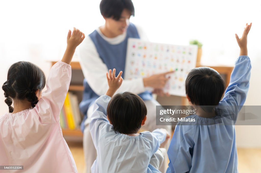 Children studying hiragana at nursery school