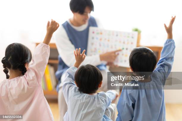 children studying hiragana at nursery school - preschool student stock pictures, royalty-free photos & images