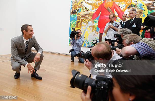 Artist Jeff Koons poses in front of his art work 'Antiquity 3, 2011' during the opening of the exhibition 'Jeff Koons. The Painter & The Sculptor' at...