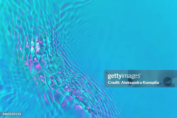 ethereal bright holographic blue, pink, turquoise, mint green transparent water surface texture with ripples, splashes, waves - crazy holiday models stock pictures, royalty-free photos & images