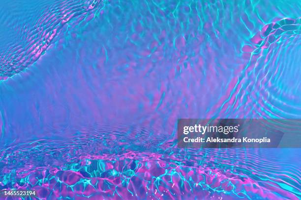 ethereal bright holographic blue, pink, purple, mint green transparent water surface texture with ripples, splashes, waves - psychedelic trip stock pictures, royalty-free photos & images