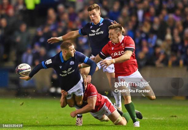 Finn Russell of Scotland passes the ball out the back of his hand during the Six Nations Rugby match between Scotland and Wales at Murrayfield...