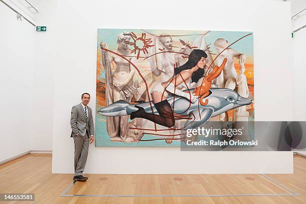 Artist Jeff Koons poses in front of his art work 'Antiquity 3, 2011' during the opening of the exhibition 'Jeff Koons. The Painter & The Sculptor' at...