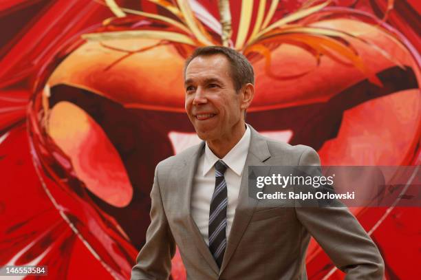 Artist Jeff Koons poses in front of his art work 'Hanging Heart, 1995-1998' during the opening of the exhibition 'Jeff Koons. The Painter & The...