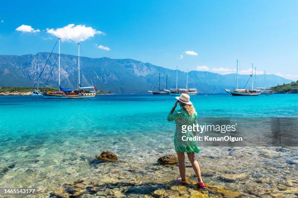 female tourist on sedir island in marmaris district of mugla province in turkey. - aegean islands stockfoto's en -beelden