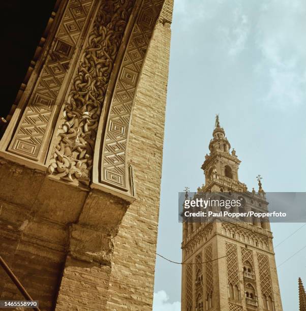 View from the Puerta del Perdon of the Giralda bell tower of Seville Cathedral in the centre of the city of Seville, capital of the province of...