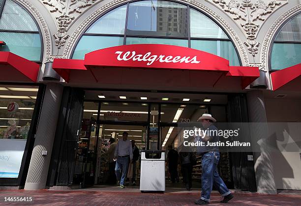 People walk by a Walgreens store on June 19, 2012 in San Francisco, California. U.S. Based drug store chain Walgreens has announced a deal to...