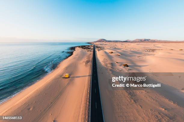coastal road in the desert - fuerteventura beach stock pictures, royalty-free photos & images