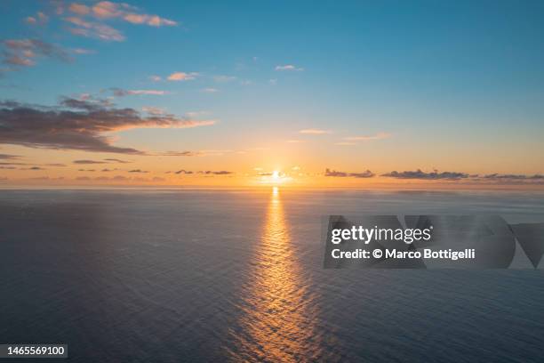 sunset over the atlantic ocean - sunset sea stock pictures, royalty-free photos & images